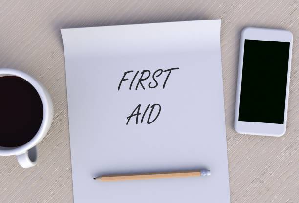 istock FIRST AID, message on paper, smart phone and coffee on table, 3D rendering 1178696956