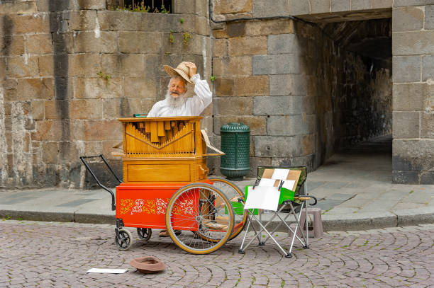 May 3rd, 2023,Youbu(游埠),Jinhua City,Zhejiang Province, China: Senior man in traditional clothing selling ice cream in old town of Youbu(游埠),Jinhua City,Zhejiang Province. Youbu(游埠) is one of the cities in zhejiang province with longest history of trade and commerce in history, which is famous for its breakfast street and local snacks on it.
