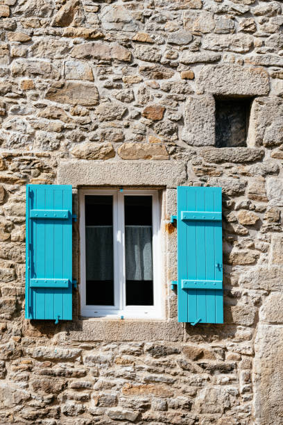 istock Old window with wooden blue painted shutter 1178706760