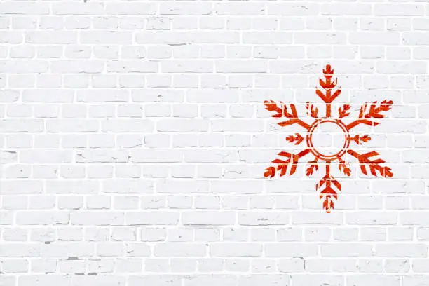 Vector illustration of Modern white color brick pattern wall texture grunge background Xmas vector illustration with a red colored creative Christmas theme snowflake graffiti graffitied on wall