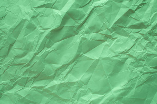 istock Green crumpled paper close up texture background 1178714117