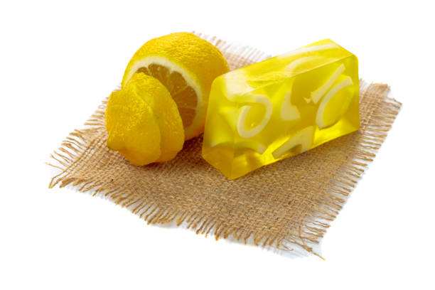Lemon sweet marmalade candy on blue background, top view. Trendy colorful photo. Minimal style with colorful paper backdrop. Flat lay fashion concept: Apricot on pastel background.