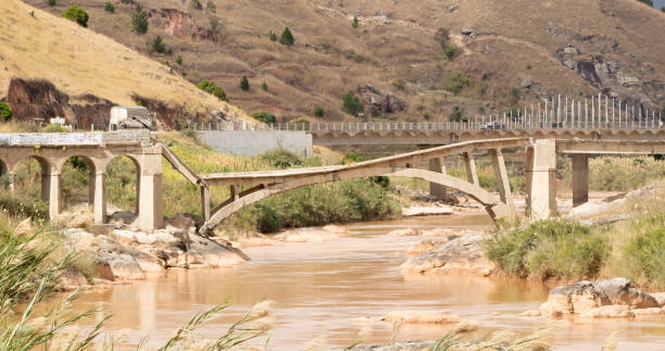 istock Collapsed bridge on Madagascar, new bridge just behind the old one 1178716964