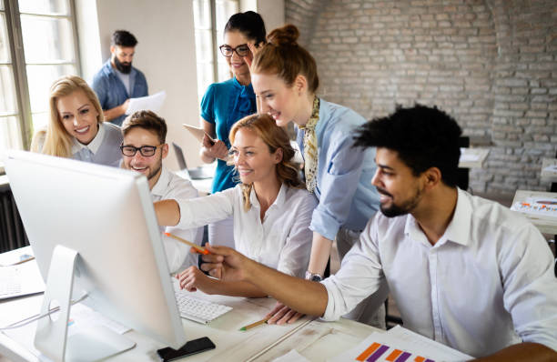 istock Successful happy group of people learning software engineering and business during presentation 1178717097