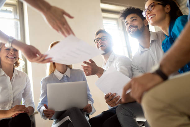 istock Successful happy group of people learning software engineering and business during presentation 1178717197