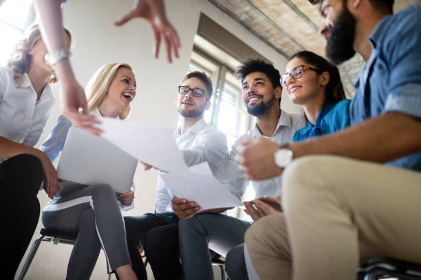 istock Successful happy group of people learning software engineering and business during presentation 1178717222