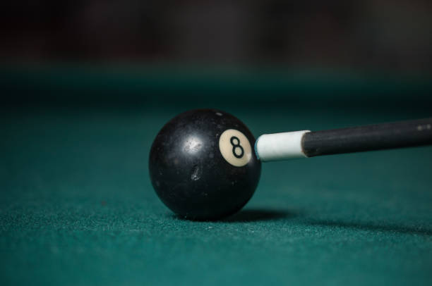 istock Billiards balls and cue on billiards table. Billiard sport concept. 1178720556