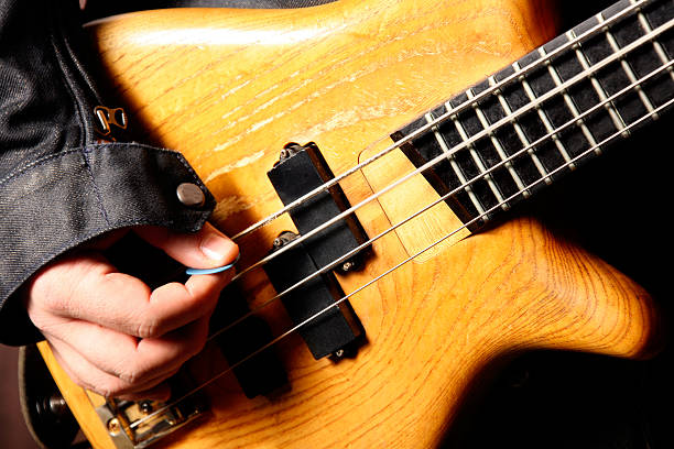 istock bass guitarist playing 117872141