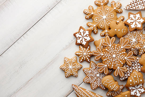 Christmas gingerbread cookies set on white planks Christmas gingerbread cookies set on white wooden background, top view christmas cookies stock pictures, royalty-free photos & images