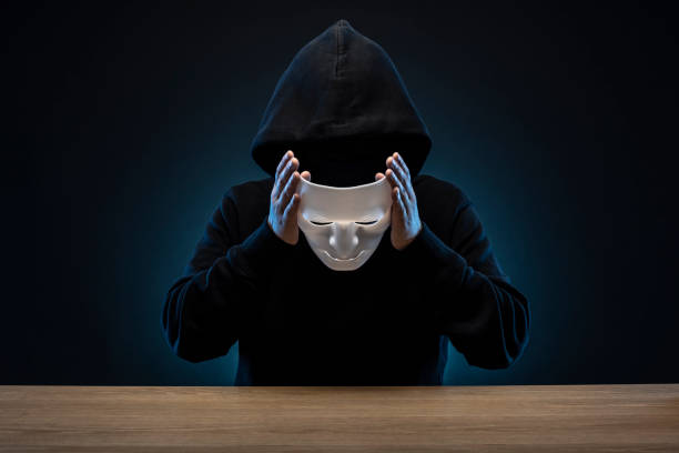 istock Masked man in hoodie 1178726766