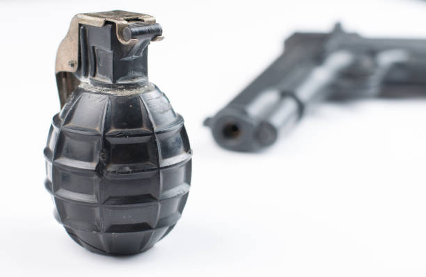 istock Gun and bomb isolated on white background.Pistol isolated. 1178727766