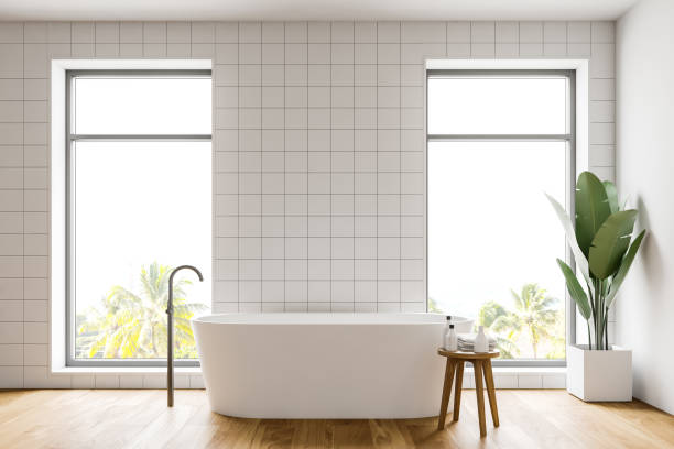 istock White tile bathroom interior with tub 1178727994