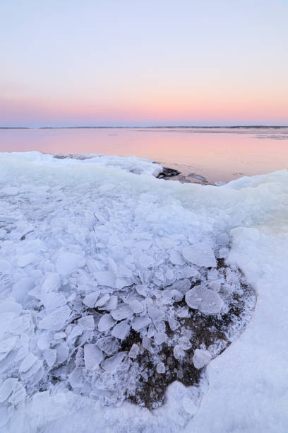 istock Frost ice blocks in lake shore rock at dusk 1178728039