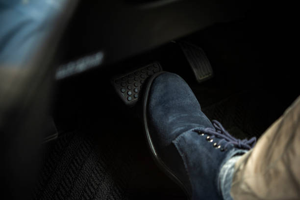 Step on the car brake Step on the car brake stepping stock pictures, royalty-free photos & images