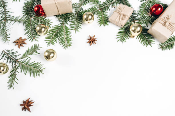 istock Christmas handmade gift boxes decorated with craft paper and branch on white background. Christmas, winter, new year concept. Flat lay, top view, copy space 1178729410