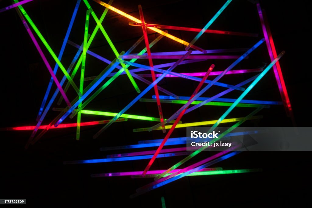 many glow stick shinny with dark background Glow Stick Stock Photo