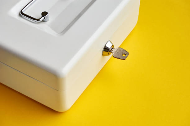 istock White closed cashbox on yellow background 1178733933