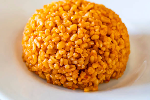 traditional turkish bulgur pilaf with tomato sause in plate