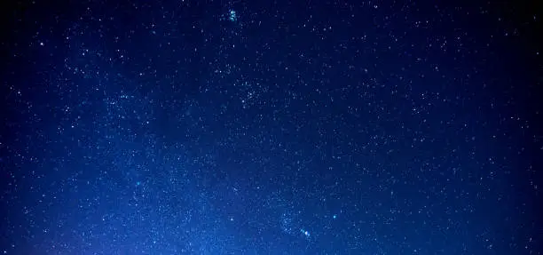 Panorama Sky and Stars, Long exposure photograph, with grain and select white balance.Night sky.