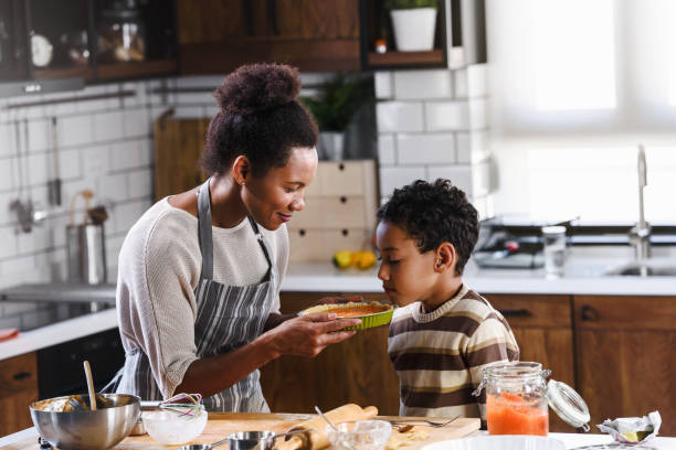 istock Mother and son baking together 1178734984