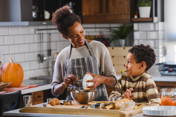 istock Mother and son baking together 1178735107