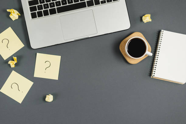 istock Asking, Decisions. Question mark on sticky notes, notebook, cup coffee, laptop, pen on blue background. FAQ concept. Working with clients. Troubles in work. Flat lay, top view, copy space 1178735131