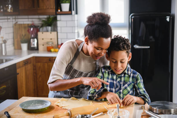 istock Mother and son baking together 1178735188
