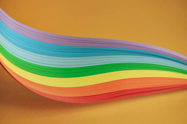 istock Beautiful rainbow color ribbon on orange background. 1178735384