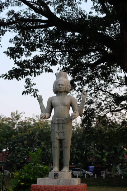 istock Sculpture of a four-armed Hindu deity. Mythical creature with four faces. 1178736283