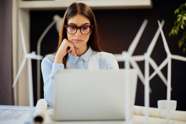 istock Businesswoman using laptop in office. Sustainable development concept. 1178736338