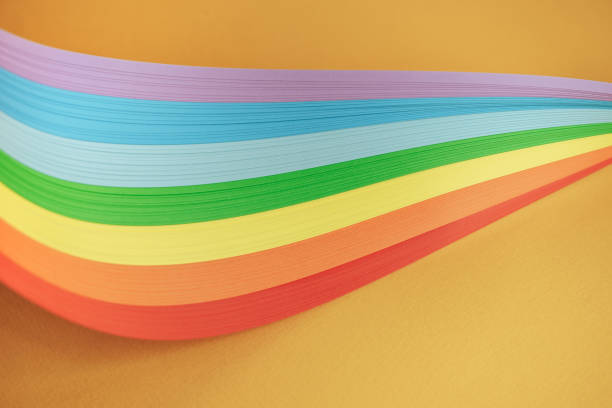 istock Beautiful rainbow color ribbon on orange background. 1178737447