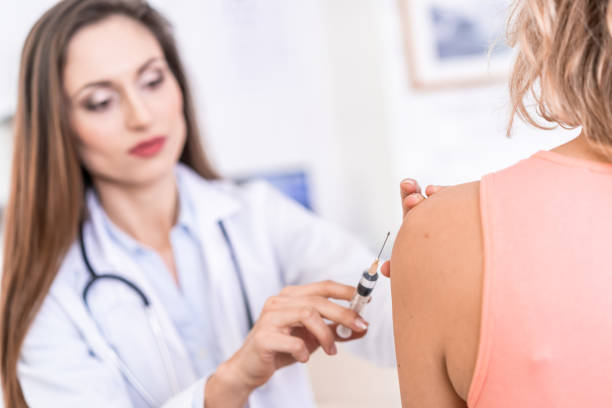istock Female doctor vaccinating a patient 1178737471