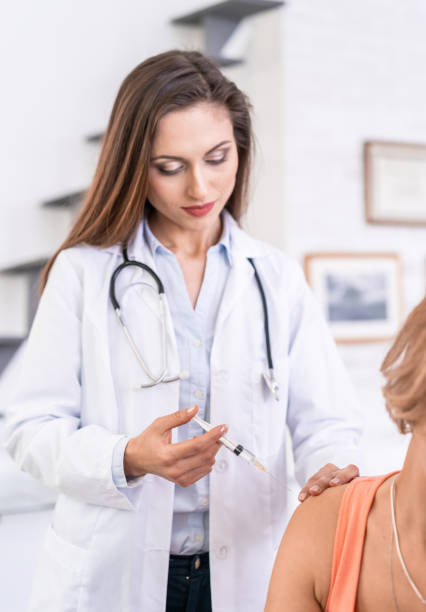 istock Female doctor vaccinating a patient 1178737472