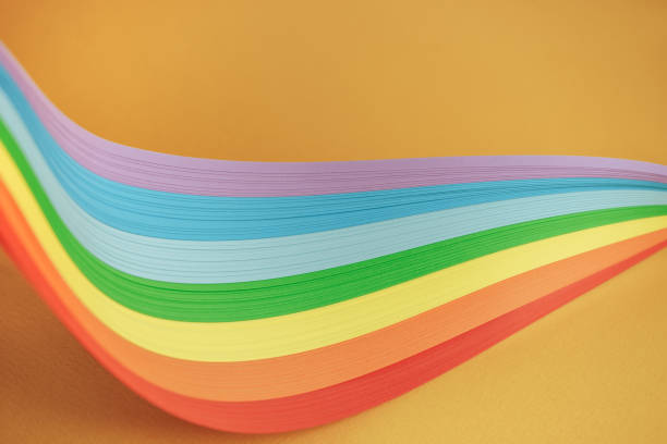 istock Beautiful rainbow color ribbon on orange background. 1178737604