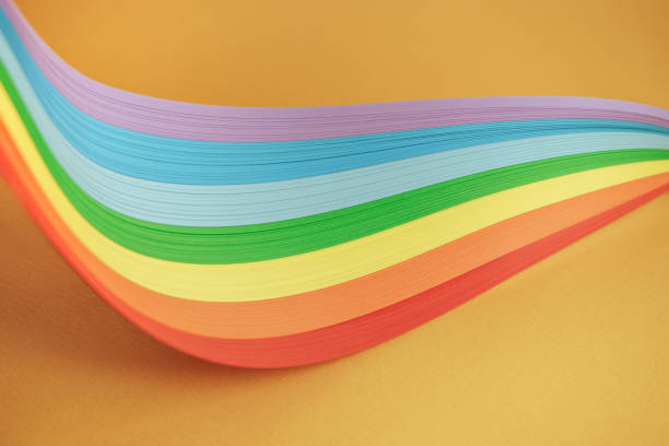 istock Beautiful rainbow color ribbon on orange background. 1178737660
