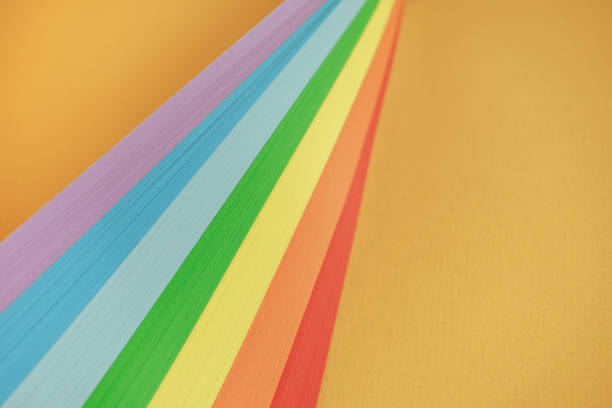 istock Beautiful rainbow color ribbon on orange background. 1178738909