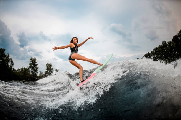 istock Female wakesurfer does stunts on a board 1178739686