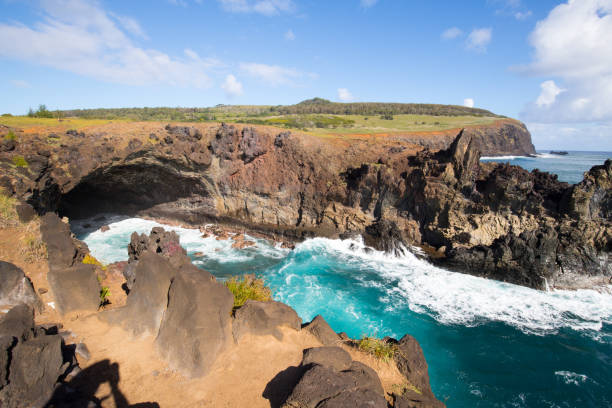 A bay with Ana Kai Tangata cave along the coast of Easter Island, Chile stock photo