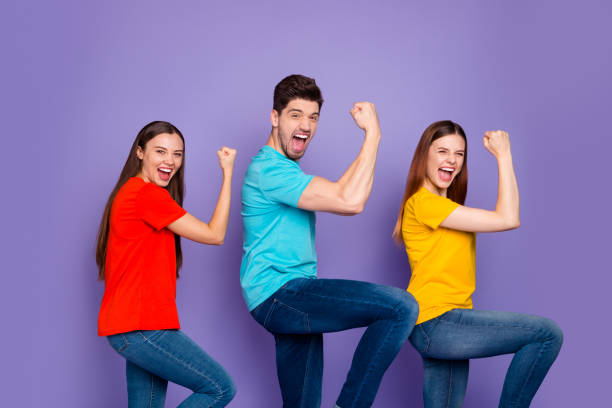 istock Profile side view portrait of nice attractive lovely charming content cheerful cheery overjoyed guys wearing colorful t-shirts jeans having fun isolated over violet lilac background 1178742580