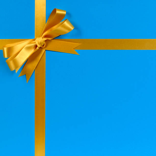 istock Gold bow gift ribbon blue background 1178742604