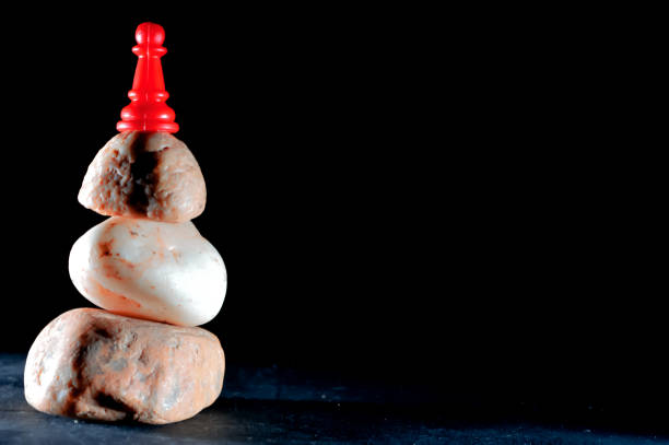 istock Black backgrouund and pawn 1178747136