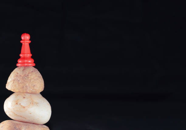 Top view of red pawn and stone Crains