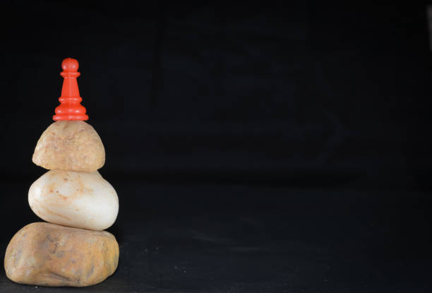 istock Stone Cairns on pawn like success man type 1178747215