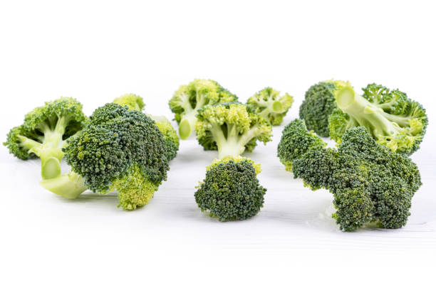 istock group of broccoli on white wooden surface front view 1178748347