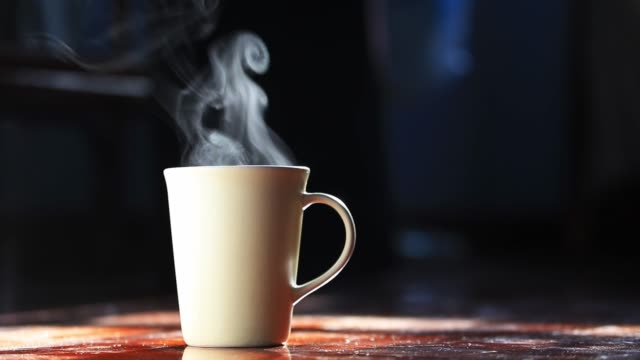 https://media.istockphoto.com/id/1178750999/video/4k-hot-smoke-over-home-brew-espresso-coffee-cup-on-the-dark-background-by-the-morning-light.jpg?s=640x640&k=20&c=CBeWy7R9QX_6g-uM_0u4mNoR49Pc3GgUJneIGTFqMqk=