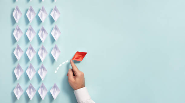 istock Leadership Concept with Businessman and Paper Ship 1178751032