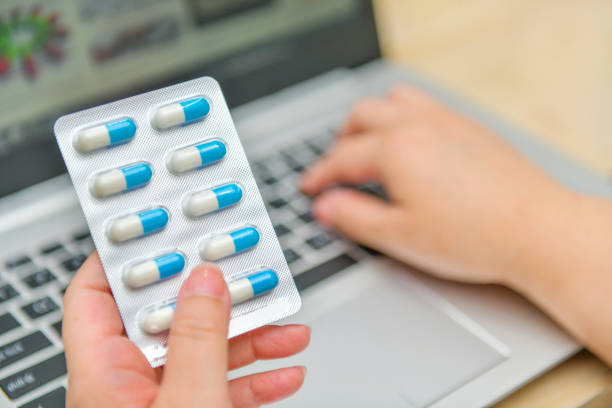 istock Pharmacist using the computer laptop in pharmacy drug store 1178751665