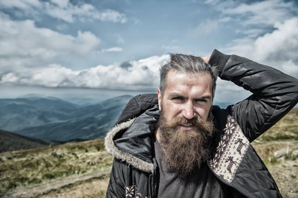 istock man hipster with beard in mountain top 1178751850