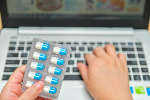 istock Pharmacist using the computer laptop in pharmacy drug store 1178756025