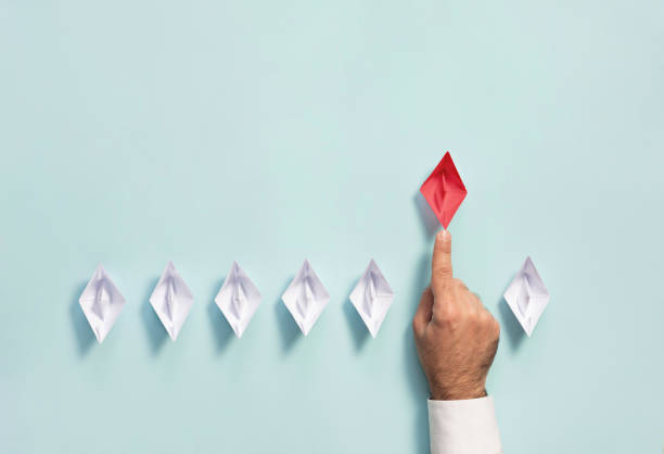istock Leadership Concept with Businessman and Paper Ship 1178756093